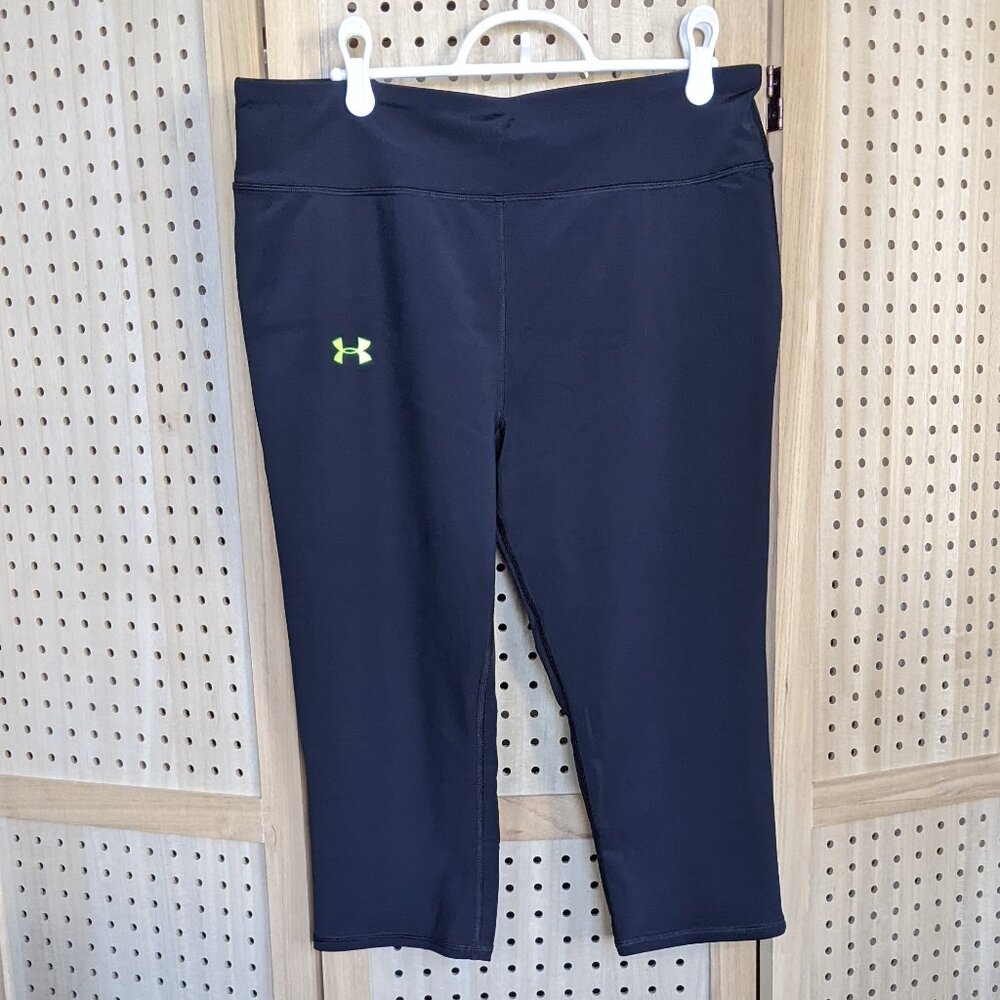 Under Armour black capri leggings with neon green accents